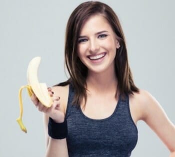 pretty girl holding a banana