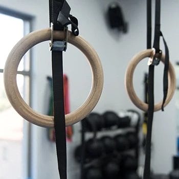 A closeup shot of gymnastic rings in the gym