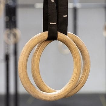 A close up shot of wooden gymnastic rings