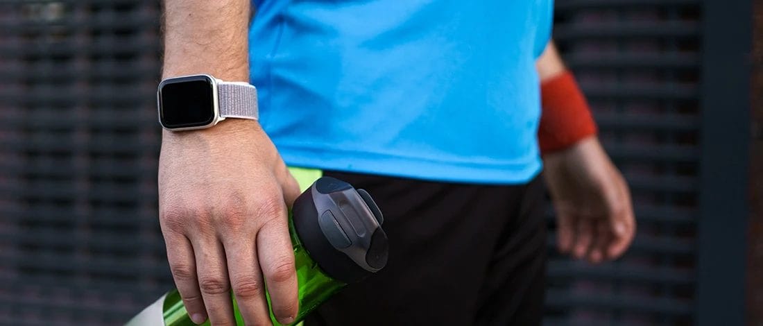 A close up shot of a man wearing the best fitness tracker for CrossFit
