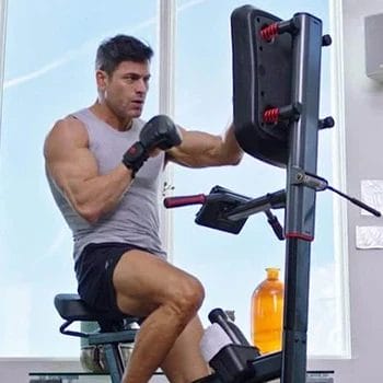 A man using a pre-programmed workouts from the Lifespan Cycle Boxer