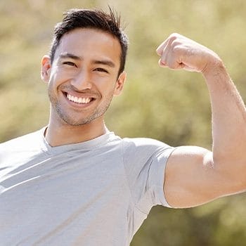 Flexing muscles outdoors