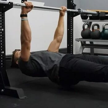 man doing inverted rows