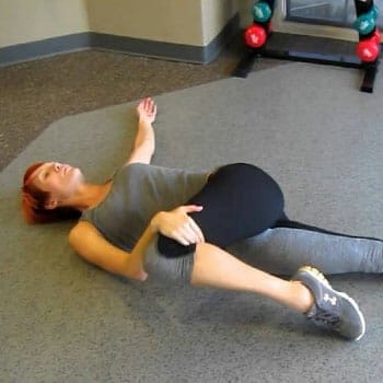 woman in a torso rotation stretch position