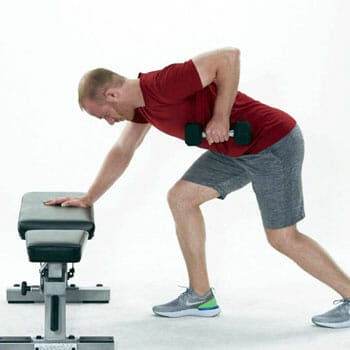 man doing a standing dumbbell row