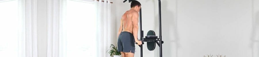 man working out using a power tower