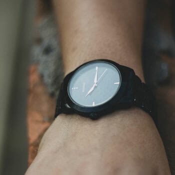 person wearing a black modern watch
