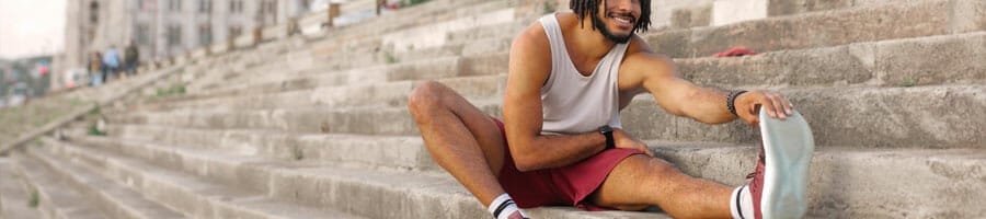 man stretching outdoors
