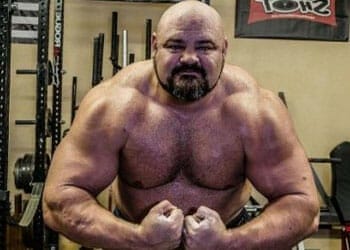 shirtless brian shaw flexing his body muscles