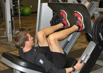 man doing leg press