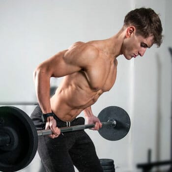 man working out his arms with a long barbell