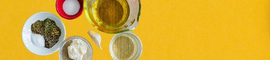 Oil free vegan salad dressing on a yellow background