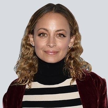 Nicole Richie smiling in front of the camera