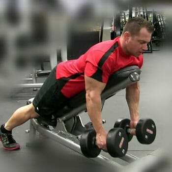 man in an incline dumbbell row position