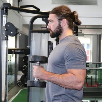 man working out using dumbbells