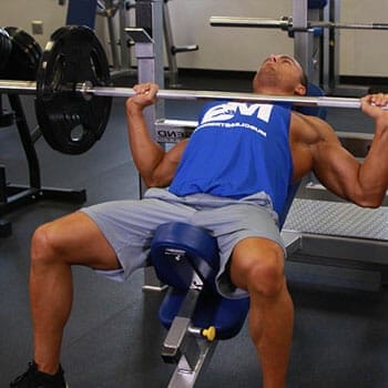 man in an incline bench press position