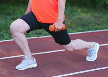 man working out his legs outdoors