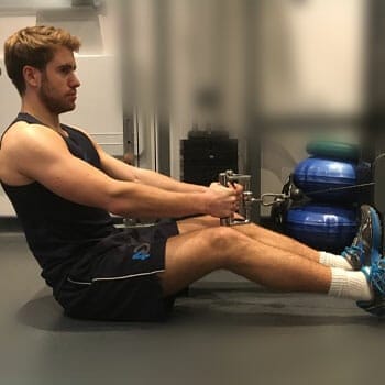 man in a seated cable row position