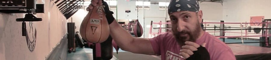 man with a speed bag on his hand