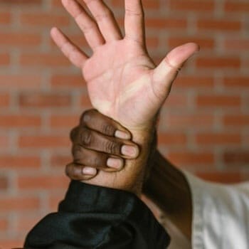 man grabbing another's wrist