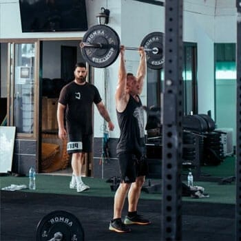 man weightlifting inside a gym