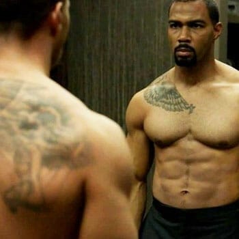 omari hardwick shirtless and looking at the mirror
