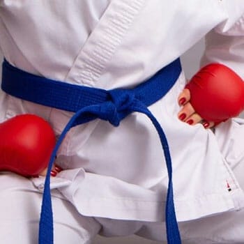 a close up image of a blue belt woman