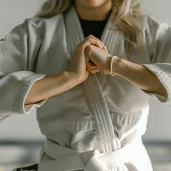 woman in a white martial arts uniform