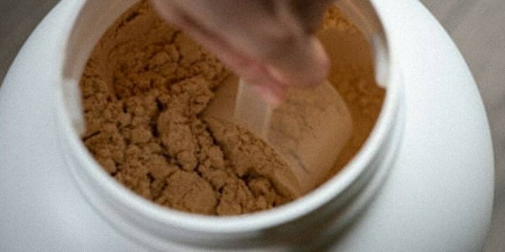 A big scoop of creatine from a container