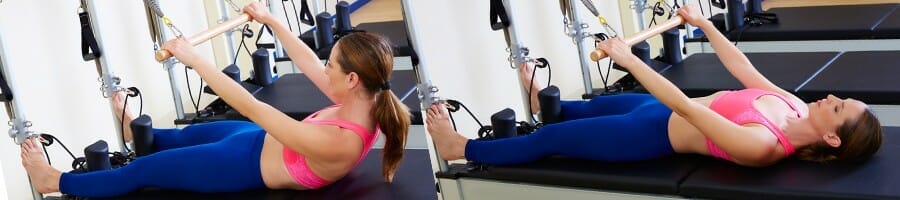 Woman doing Pilates reformer roll up exercise