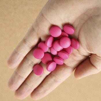 Pink supplements on hand