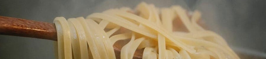 scoop of freshly cooked pasta