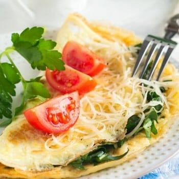 plate of omelet and vegetables