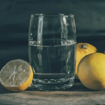 fresh lemon and a glass filled with water
