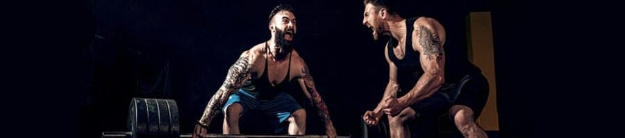 two men hyping each other during a barbell lift