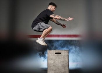 man working out using box jumps