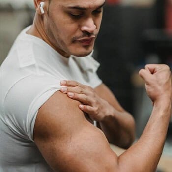 man flexing his bicep muscles
