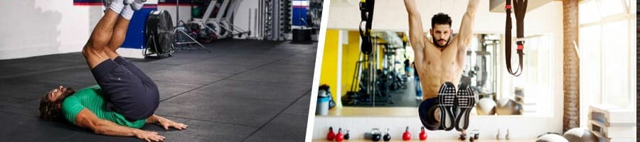 man doing reverse crunches in a gym, man doing hanging leg raises