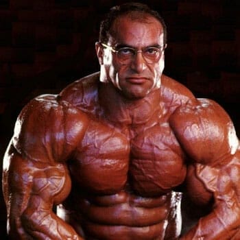 Nasser El Sonbaty showing off his body muscles
