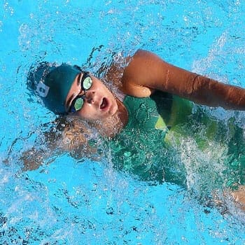 woman in a swimming pool practicing a back stroke