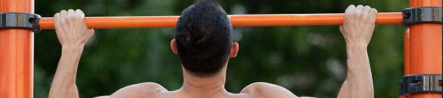 Pull up bar being used by a guy