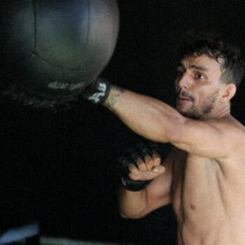 A guy punching and training for boxing