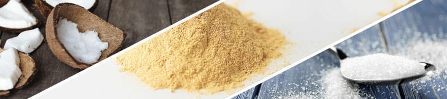 palm oil in a coconut, brown powder in a table, spoon filled with sugar