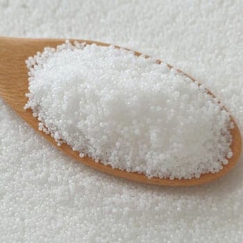 spoon filled with stearic acid powder