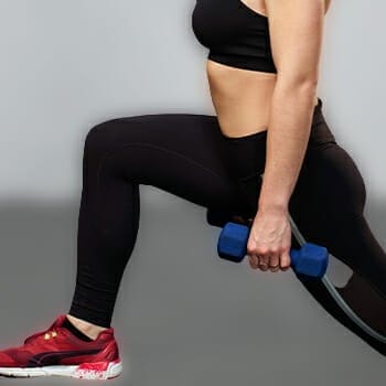 Woman doing walking lunges exercise