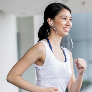 Woman smiling while jogging