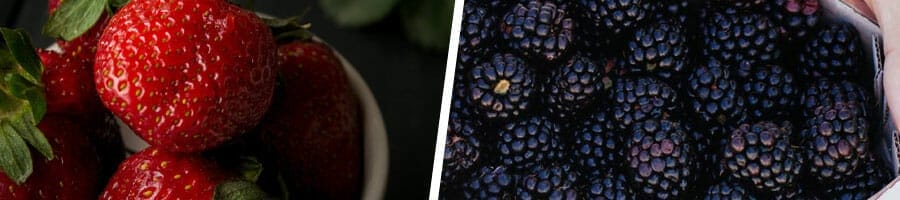 bowl of fresh strawberries, and a stack of black berries
