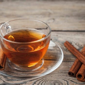 glass cup filled with honey and cinnamon