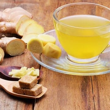 sliced ginger and a cup of tea