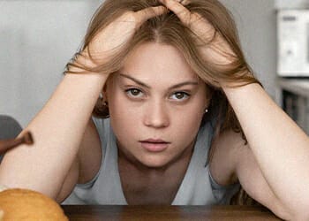 Woman stressed and holding her head